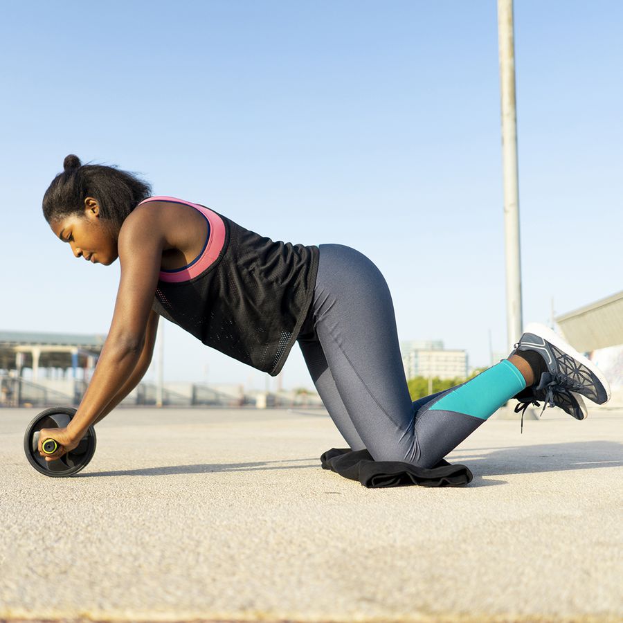Woman using an ab wheel