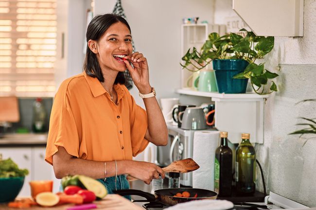 A woman cooking a meal at home